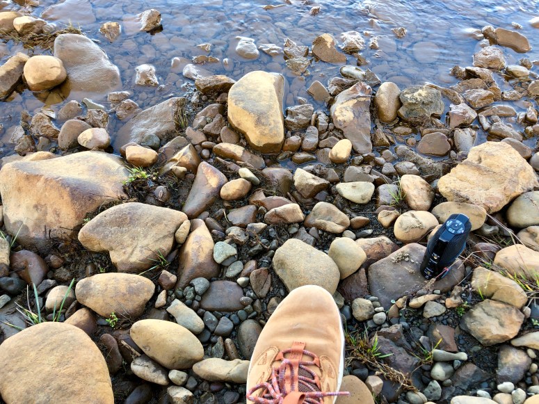 Kim V. Goldsmith recording atmospheric sound by a stream
